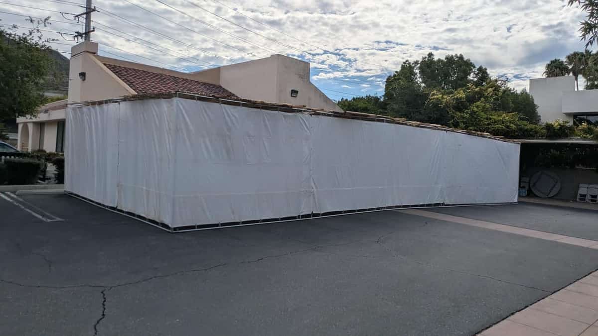 Large finished freestanding sukkah with white tarp walls