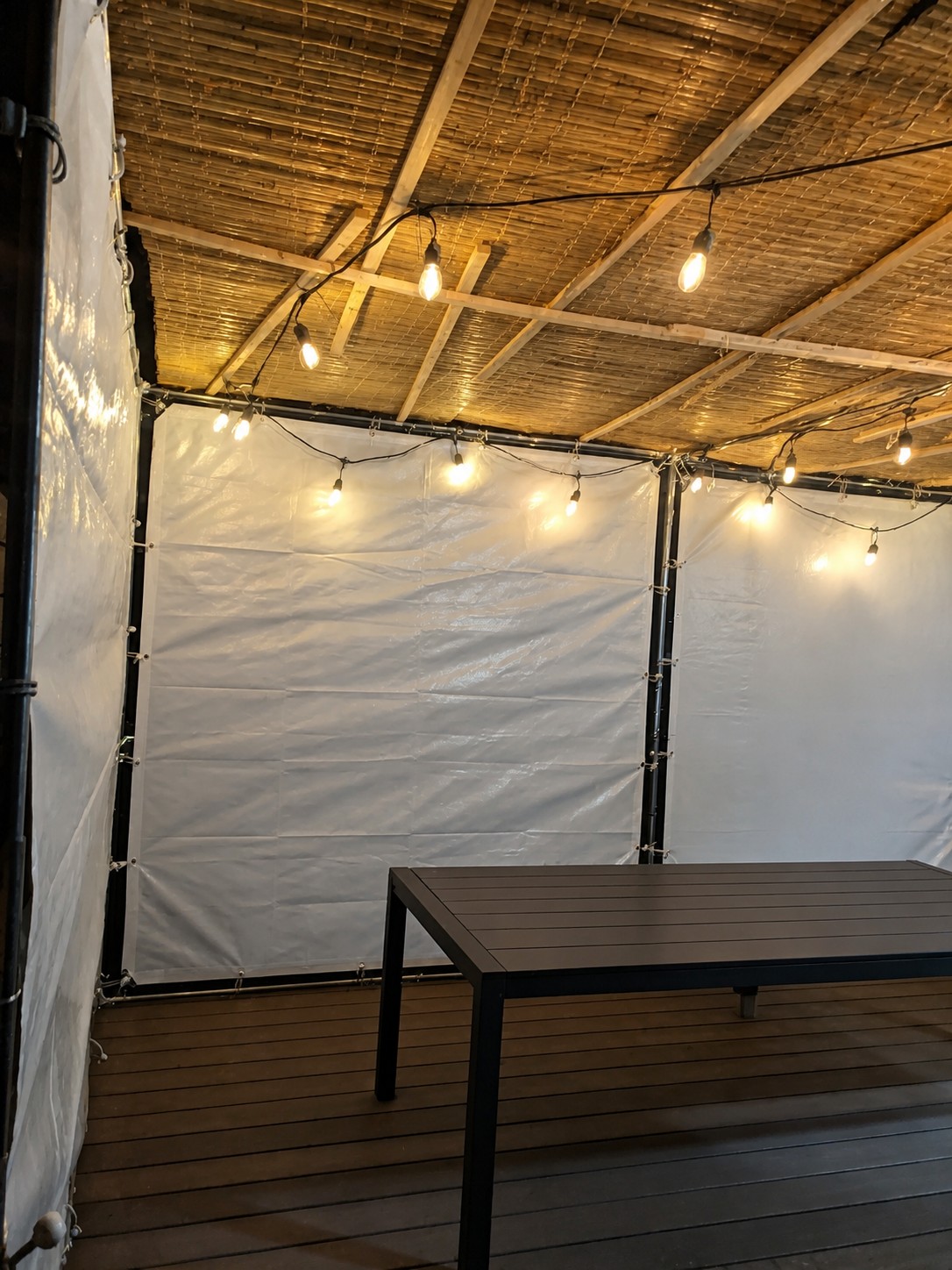 Example sukkah with clean white tarp walls