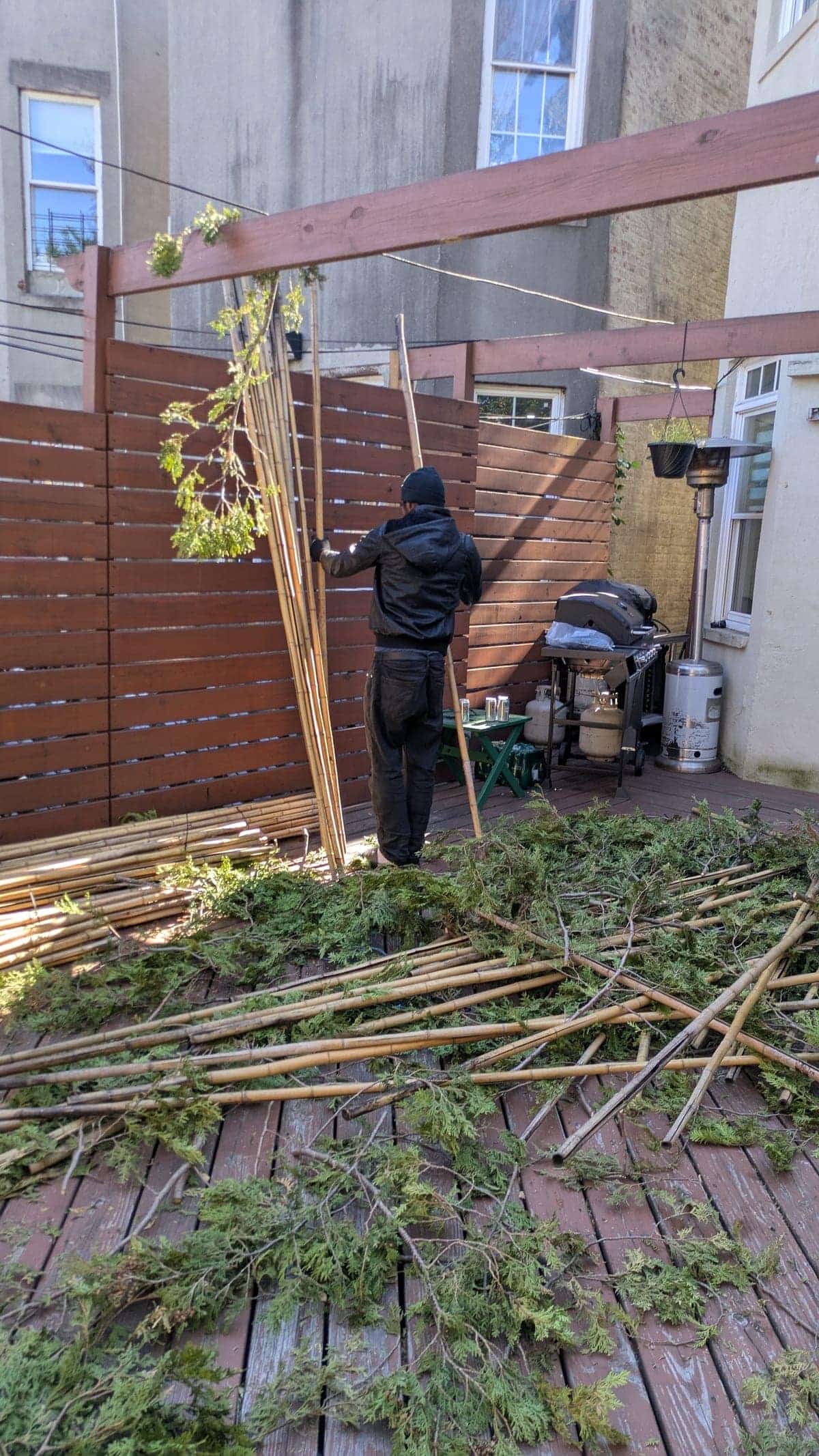 A team member assessing a sukkah space before setup