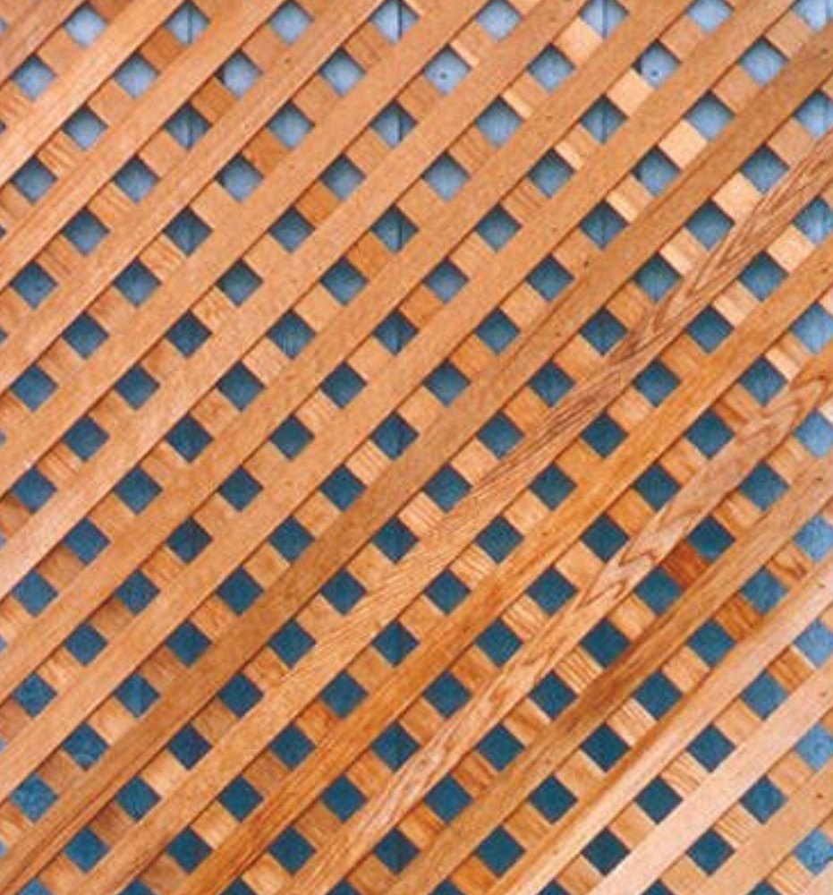 Close view of open crossed-wood lattice wall panels