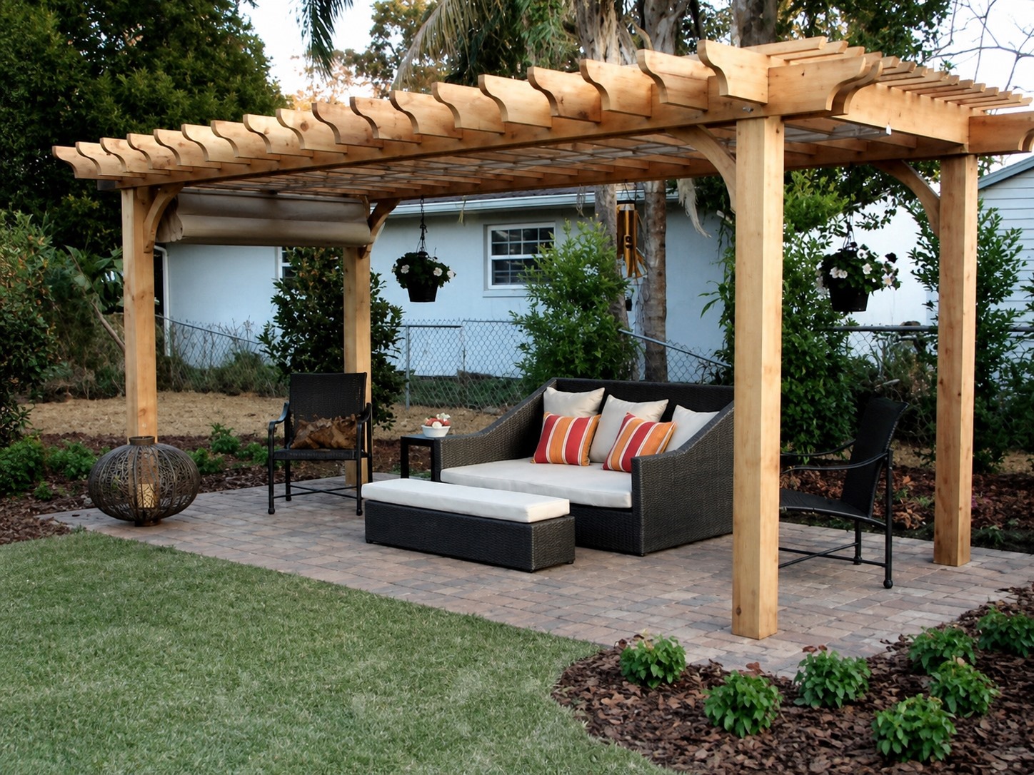Freestanding timber pergola over backyard seating with a slatted roof
